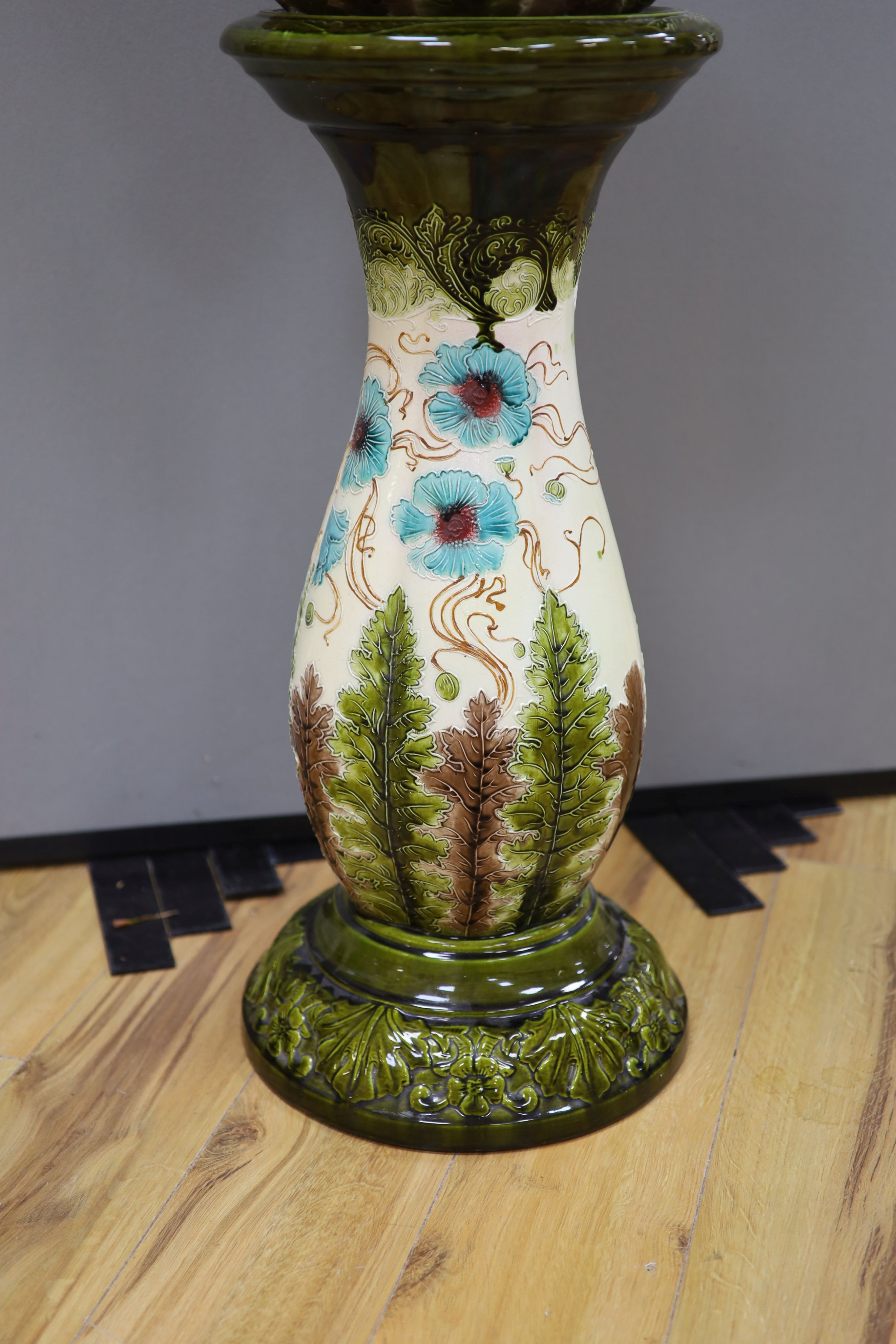 A Burmantofts style 'poppy' jardiniere and stand, total height 96 cm